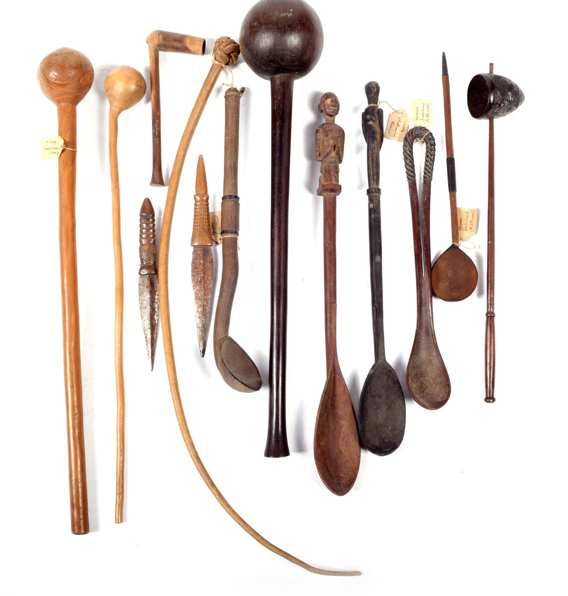 A South African knobkerrie, 53.5cm, three Zulu spoons, a Kenyan spoon