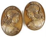 A pair of George III baltic pine ship carvings, relief carved depicting Pallas Athena sinistra and