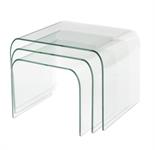 A nest of three curved glass tables, 45.2cm high, 60.5cm wide, 48.1cm deep. Provenance: The Property