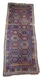 A Kurdish long rug, north west Persia, late 19th / early 20th century, 349 x 135cm.