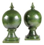 A pair of French green glazed pottery roof finials, in two sections, Avignon 52.3cm high, 25.5cm