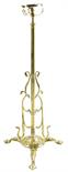 An Arts and Crafts brass standard lamp, with an adjustable stem with scrolling foliage decoration