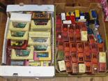 Two boxes of model vehicles