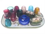 Piggy ornaments, coloured glass night lights, blue vase and two ruby glasses