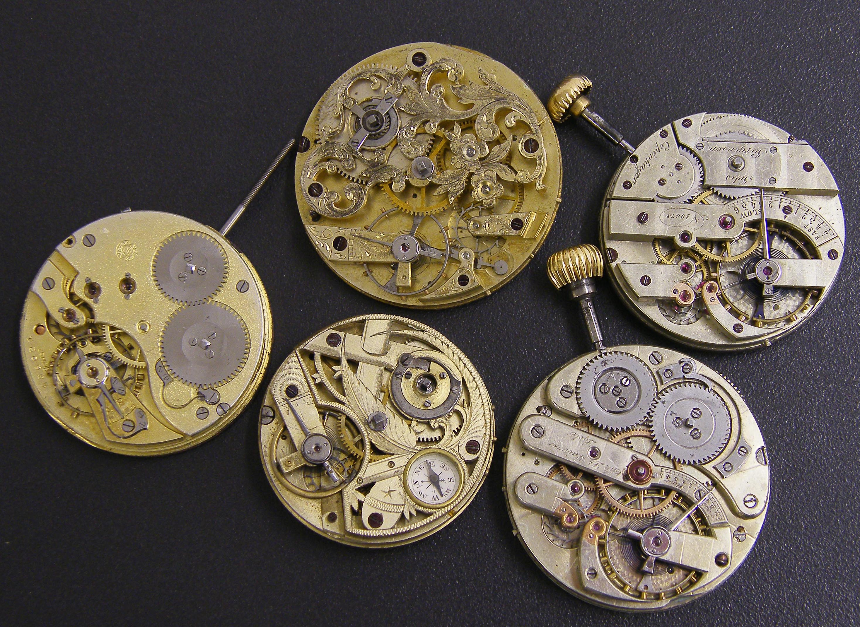 Five Continental pocket watch movements including an IWC lever movement