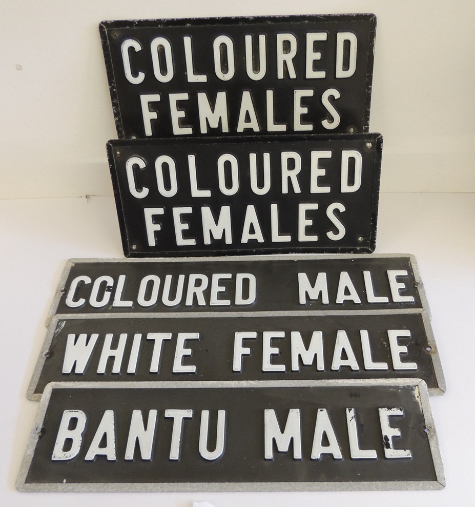 A group of five South African apartheid signs, each wall sign with