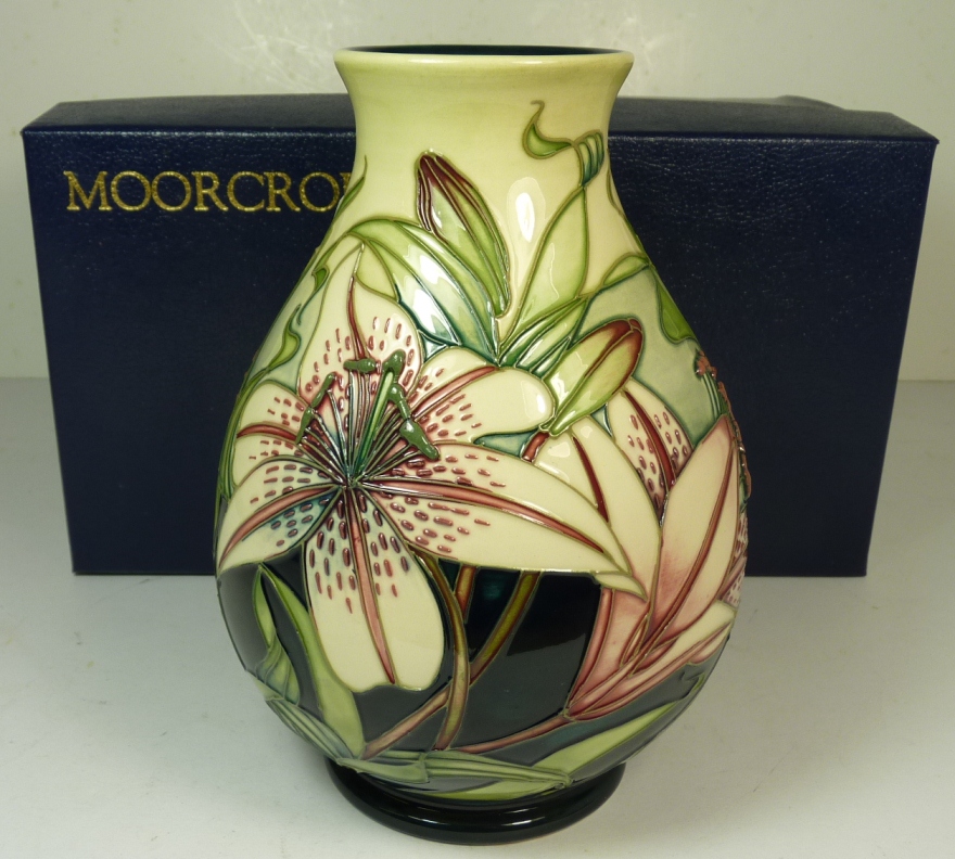 A modern Moorcroft pottery vase with Lilly pattern, dated 2002, 19.5cms