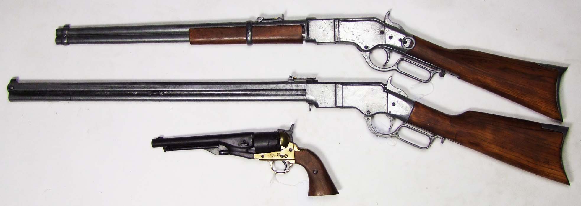 Three decorative replica firearms a Henry Rifle, a Winchester 1873