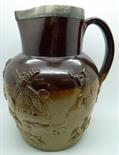 A 19th Century saltglaze relief moulded jug with hunting scenes, with silver rim, rim hallmarked