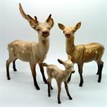 Three Beswick deer, one a/f