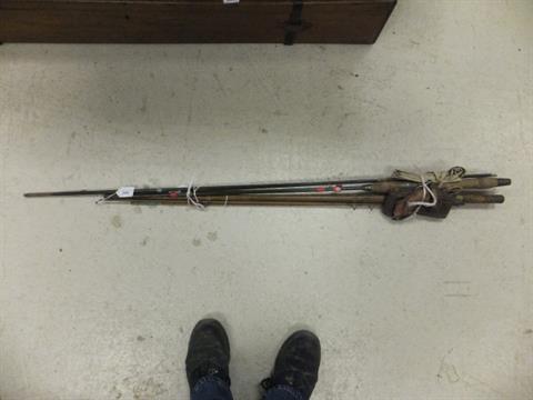 Two Vintage Fishing Rods To Include A Copper Tank Aerial And A Solid Wood Example Together With