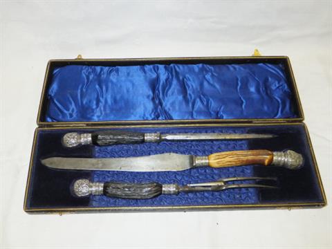 A Cased Carving Set With Horn Handles And Plated Mounts The Knife
