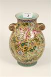 Chinese two-handled famille rose vase, painted with dragon within flowering branches against a