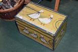 A painted wooden box decorated with ducks