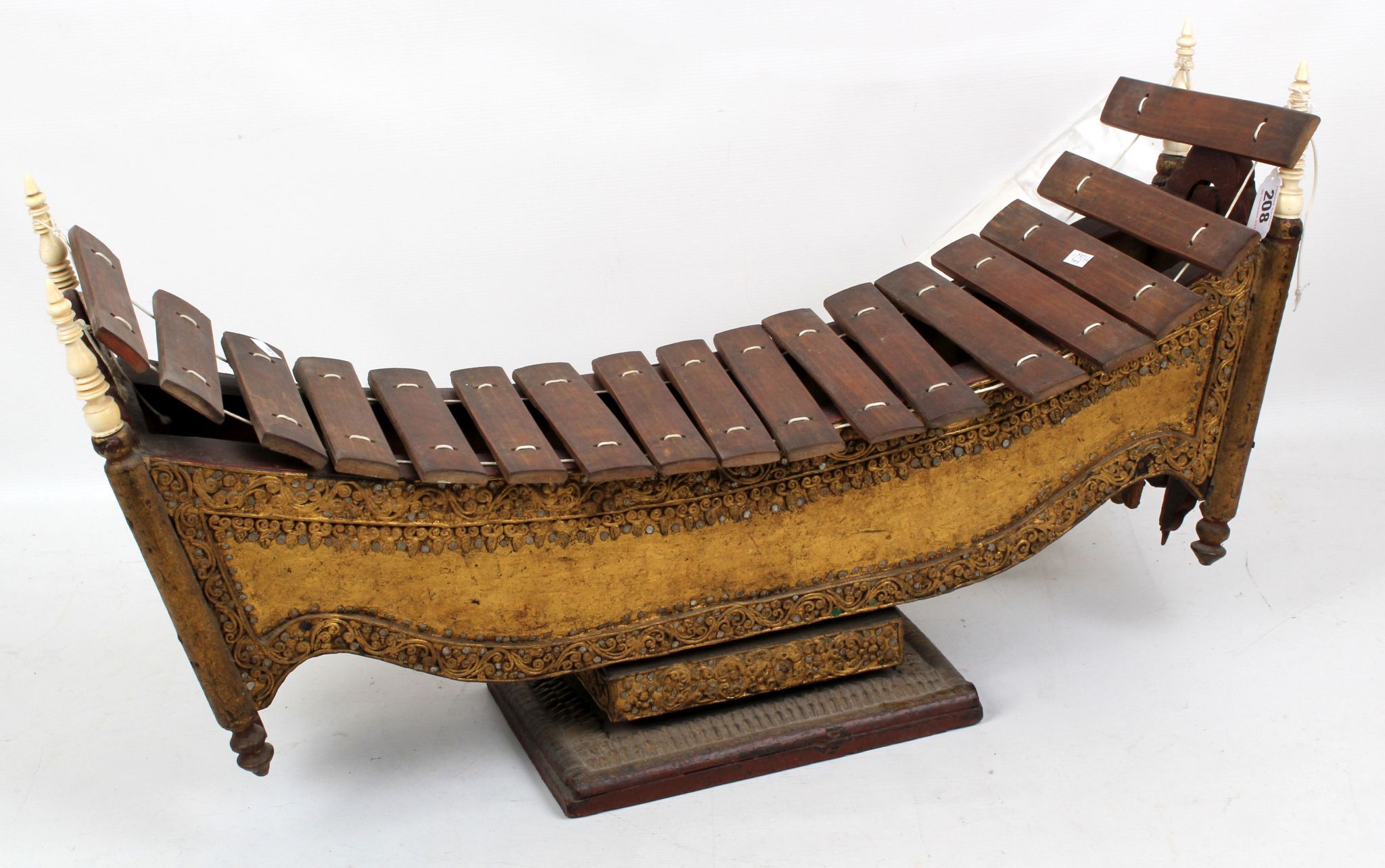A Burmese xylophone, late 19th Century, in the form of a `Royal Boat