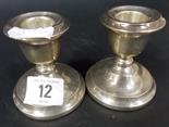 Pair of modern silver-loaded squat candlesticks.