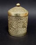 Indian white metal cylindrical lidded tea canister, repousse decorated with panels of lions and
