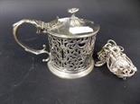 Silver plated pierced drum mustard pot with blue glass liner, and a silver plate Chatelaine chain