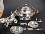 Silver plated loose flatware and an oval lidded twin handled tureen.