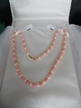 Good modern cultured pearl and coral beaded necklace with 9ct gold clasp, retailed by Savage & Co,