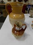 Stoneware harvest jug sprigged with figures and trees, height 6”, and a larger stoneware harvest