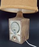 Troika pottery square section table lamp, the textured body with geometric moulding decorated in