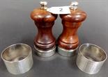 Pair of modern silver mounted turned wood salt and pepper mills, and a pair of boxed napkin rings.