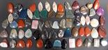 Quantity of semi-precious carved stone pendants.