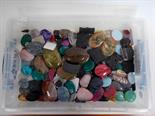 Box of various carved and polished stones.