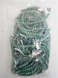 Bag of speckled green coloured uniform carved beads.