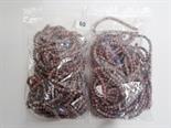 Two bags of light brown speckled stone uniform carved beads.