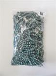 Bag of green stone uniform carved beads.