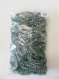 Bag of green stone uniform carved beads.