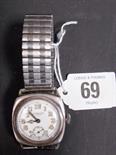 Benson’s 1930’s Silver “Tropical” wrist watch of cushion shape, the white dial with Arabic