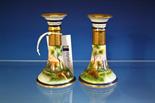 A pair of Noritake porcelain candlesticks Japanese, early 20th century, everted gilt rims above