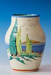 A rare Clarice Cliff `Clovelly` pattern Isis vase c.1937, the ribbed moulded vase with honey