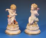 A pair of Meissen porcelain figures of Cupid from the L Series, early 20th century, one with incised