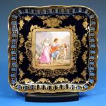 A Vienna porcelain cabinet plate late 19th century, of square form, reticulated uprising rim with