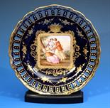 A Vienna porcelain cabinet plate late 19th century, scalloped rim with gilt decoration,