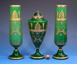 A garniture of three Bohemian cased green glass vases in the Aesthetic manner, c.1900, comprising