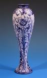 A Moorcroft MacIntyre Florian ware vase of slender inverted baluster form with waisted rim,