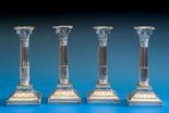 A set of four Edwardian silver table candlesticks James Dixon & Sons, Sheffield 1902 & 1903, of