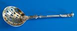 A Victorian silver sifter ladle Francis Higgins, London 1860, gilt bowl with husk piercing,