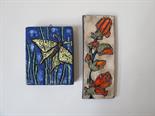 Two various West German wall tiles, floral and butterfly designs