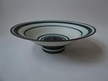 RICHARD BAXTER (b.1959) A large footed bowl, matt white glaze and green tinted black rings.