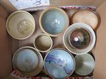 A box of studio pottery small bowls, some marked with potters seals