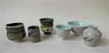 A small collection of studio pottery bowls etc, some with impressed potters marks