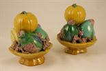 Pair of Chinese lead glazed fruit bowl ornaments, each worked with persimmon, pomegranate, peach