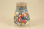 Poole Pottery vase, baluster form with wide neck, decorated with a broad band of coloured flowers,