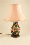 Moorcroft `Strawberry Thief` pottery table lamp, deep blue ground, fitted with a wooden base,